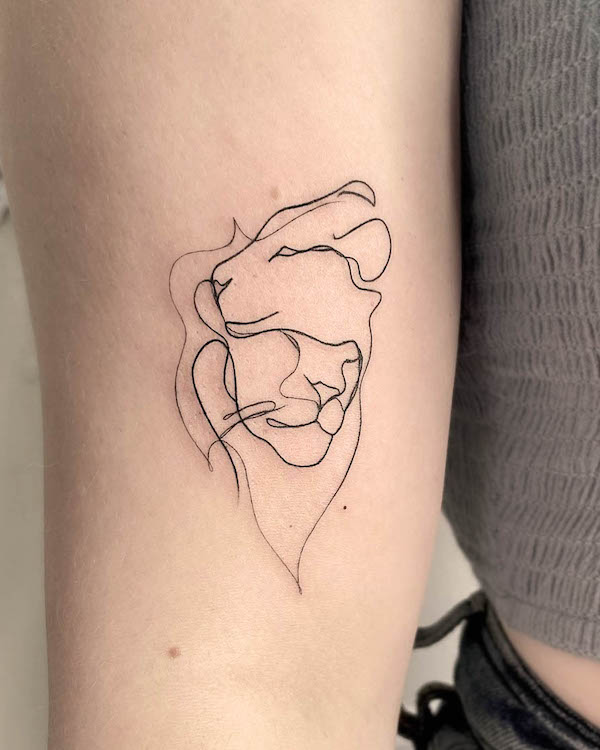 Lion and lioness one-line tattoo by @qubart_