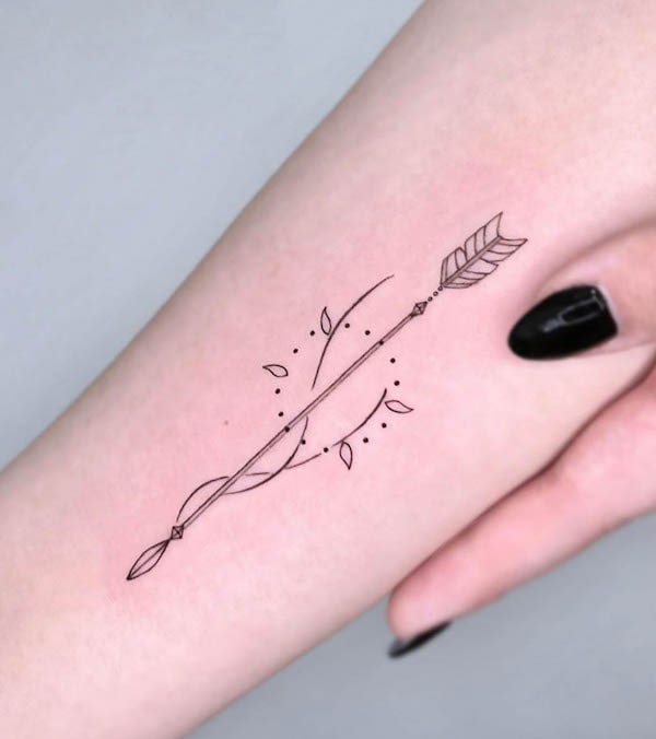 Minimalist arrow tattoo by @da.an_tattooer