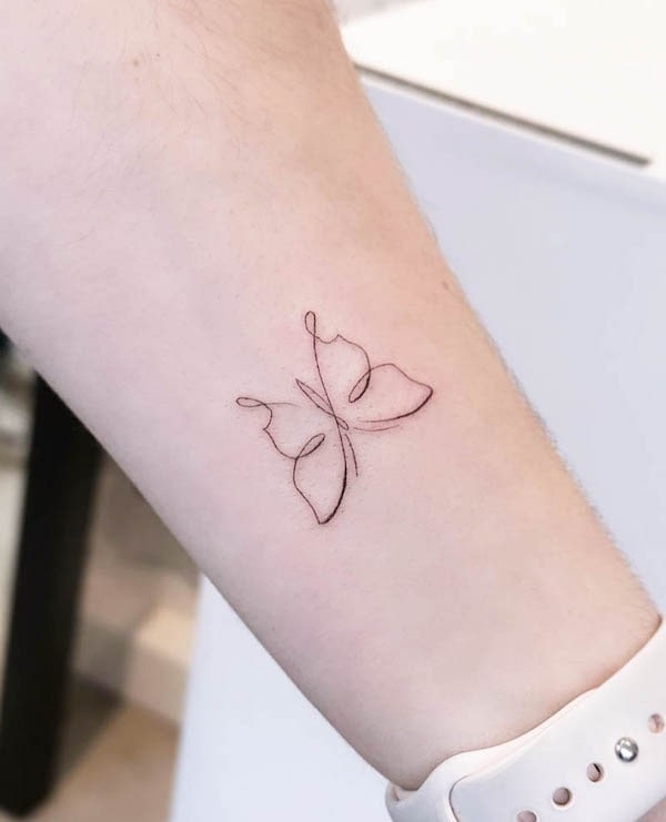 Minimalist one-line butterfly tattoo by @j.milz_tats