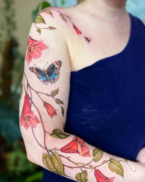 Moth and flowers full sleeve tattoo by @simonster.ink_