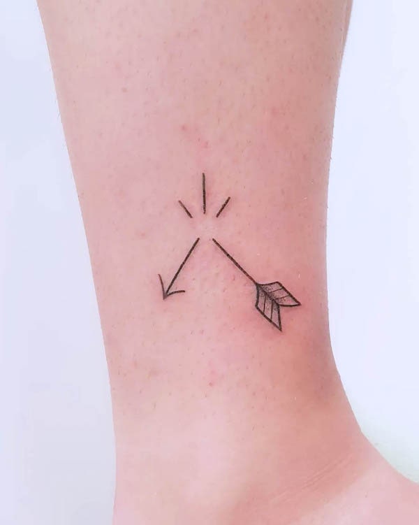 Small broken arrow ankle tattoo by @ots.kokote