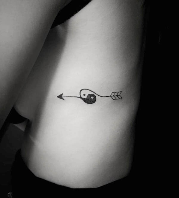 YIn and yang arrow tattoo by @guy_levi_tattoo