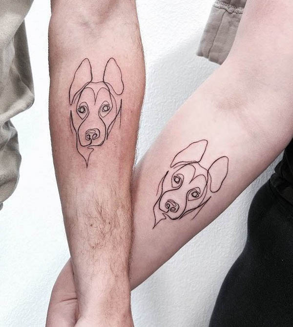 Matching dog tattoos by @tattoobyjulie