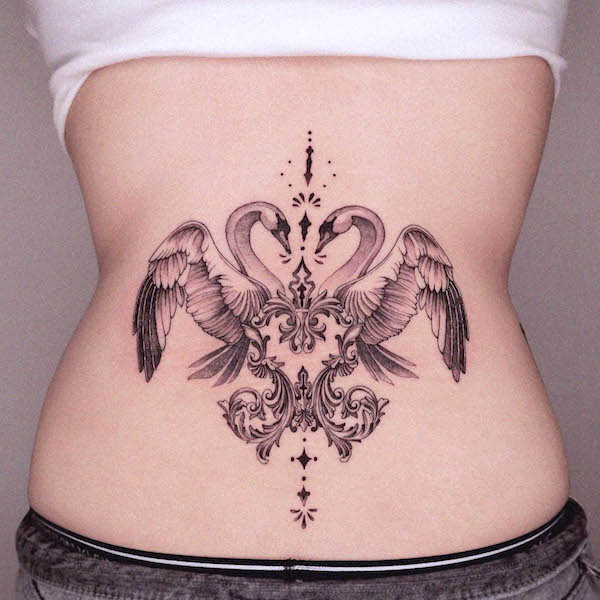 Antique symmetrical swan tattoo by @zaal.tt
