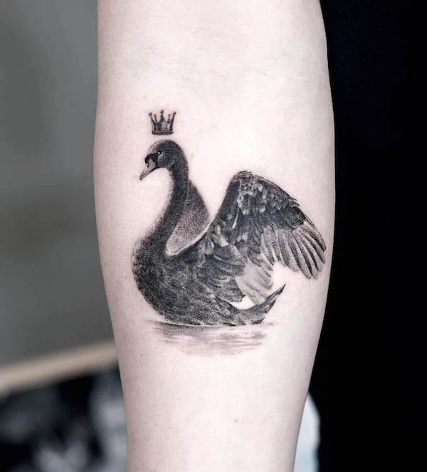 Black swan with crown tattoo by @graffittoo