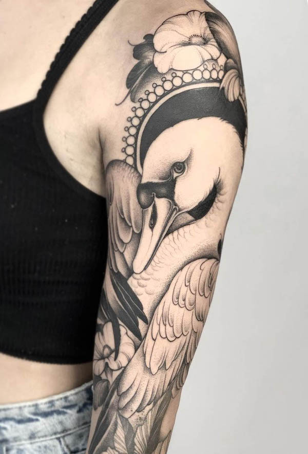 Full-sleeve swan tattoo by @_mariaruz_