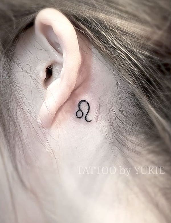 Leo symbol behind the ear tattoo by @tattoo_yu77