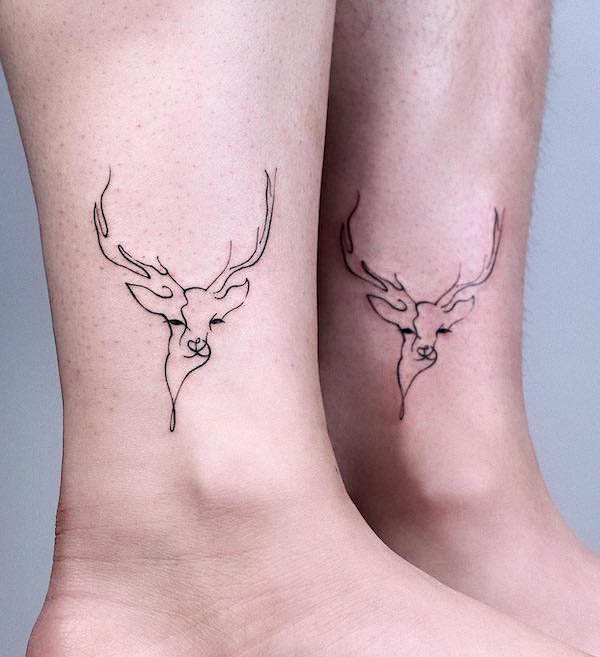Matching outline deer tattoos by @howdy_tattoo