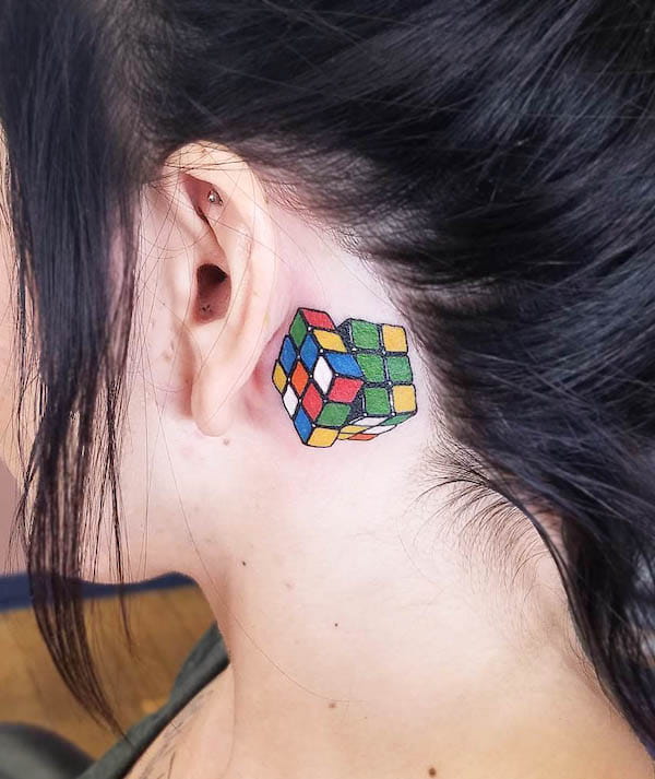 Rubik's cube behind the ear tattoo by @tattoocity24