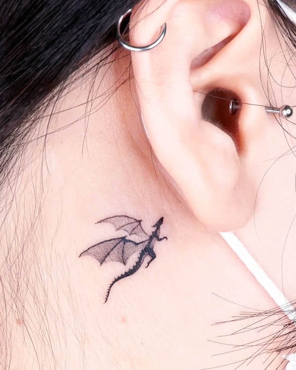 Tiny dragon behind the ear by @choiyun_tattoo