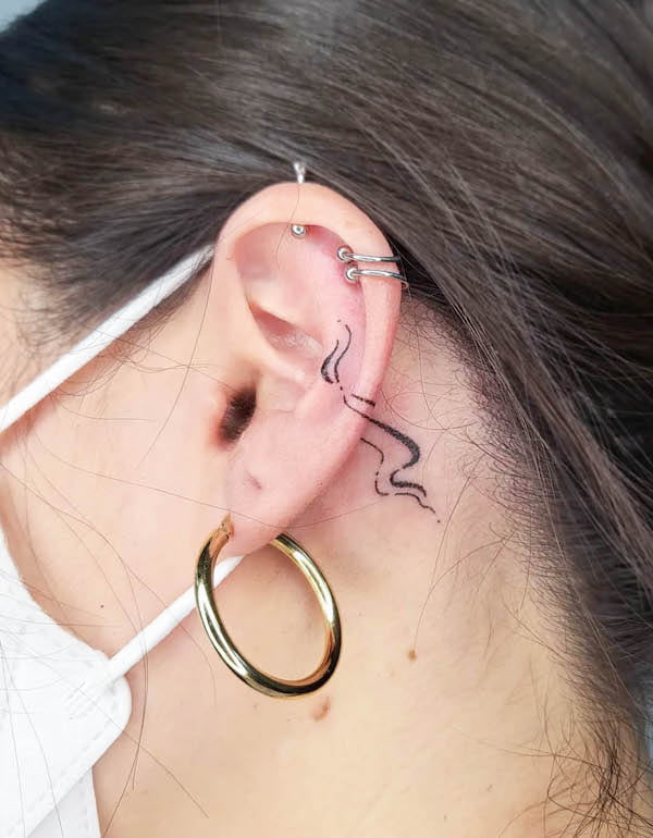 Water tattoo on the ear by @baby.citrus