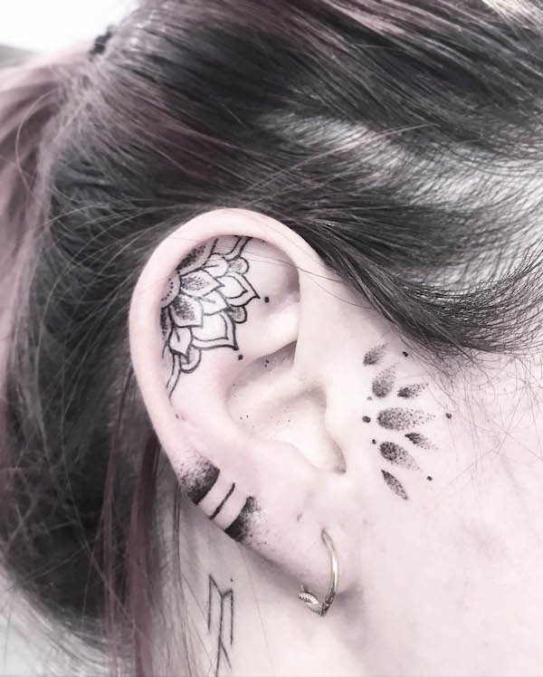 Half-mandala ear tattoo by @rica_traditional
