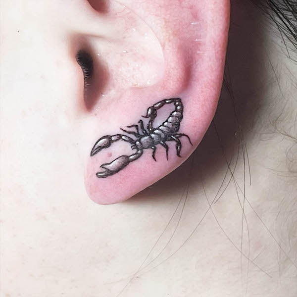 Small scorpion ear tattoo by @ryanfrancois