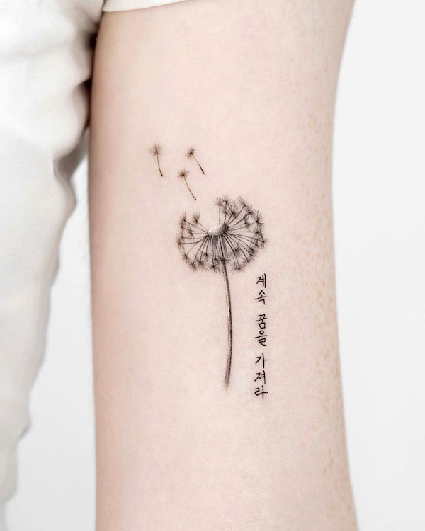 Black and grey detailed dandelion tattoo by @oble_tattoo