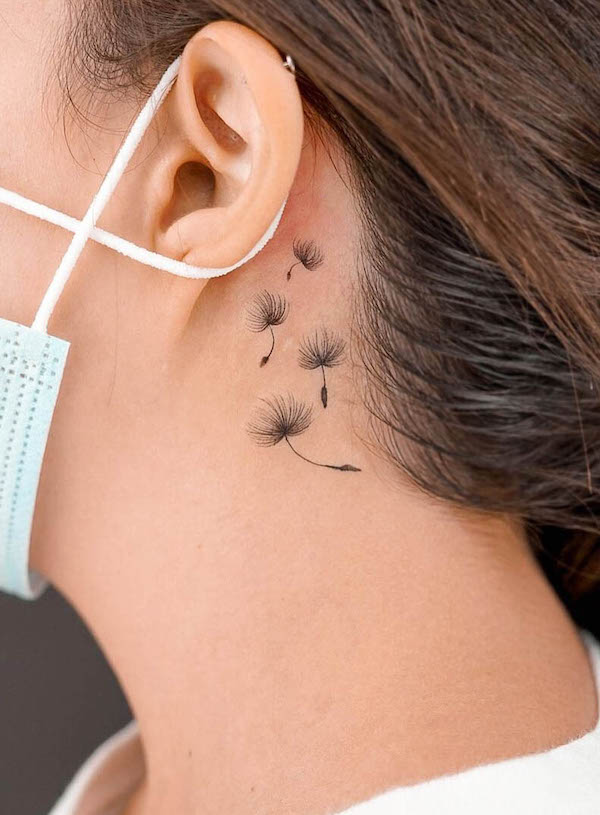 Dandelion seeds ear back tattoo by @lornetattoos