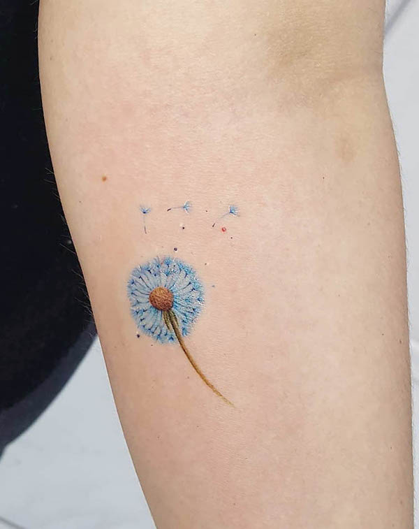 Detailed blue dandelion tattoo by @jackemichaelsen.tattoo
