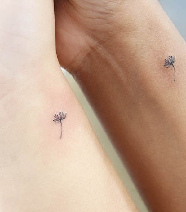 Matching dandelion seed wrist tattoos by @wittybutton_tattoo
