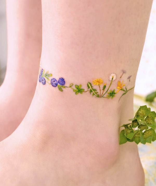 Small plants anklet tattoo by @ovenlee.tattoo