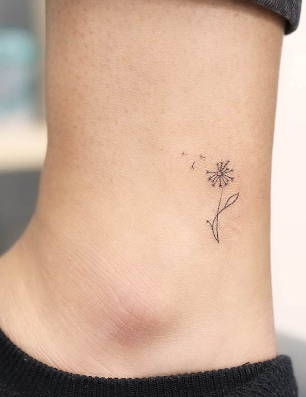 Tiny dandelion ankle tattoo by @wittybutton_tattoo