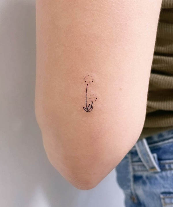 Tiny dandelion elbow tattoo by @inkykayla
