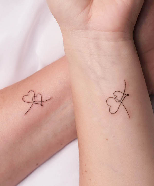 Connected hearts tattoos by @unotattoonyc