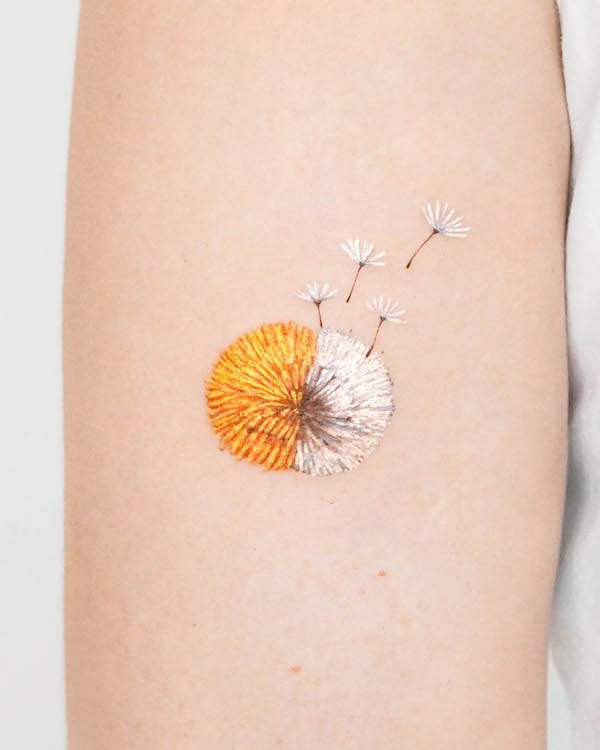 Duo-color dandelion tattoo by @tattooist_moony