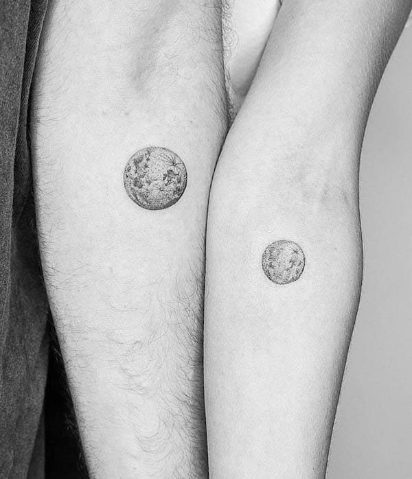 Matching planet tattoos by @benza_tattoo